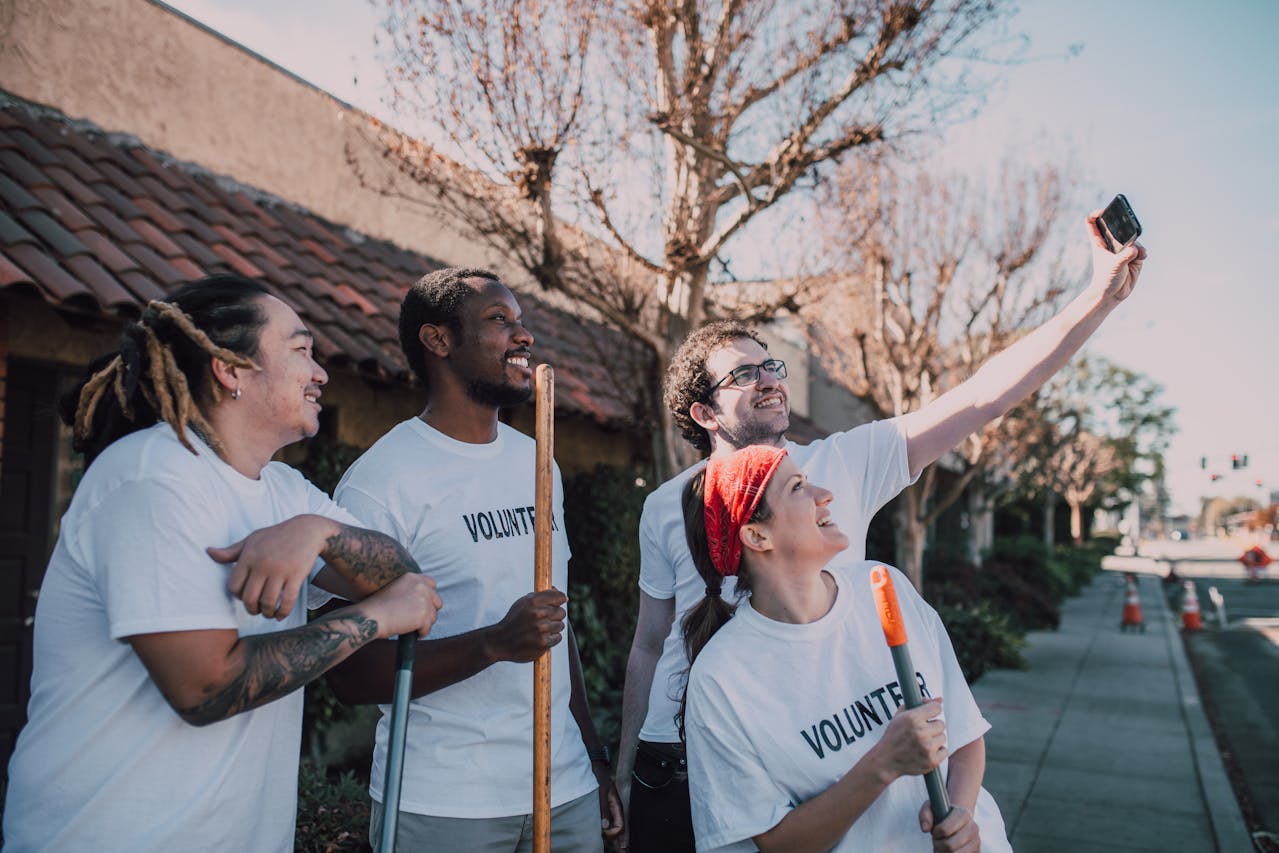 Volunteers taking a break to take a smiling selfie together